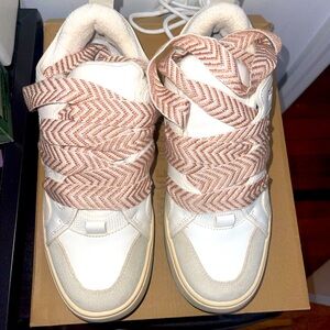 Stylish White and Beige Steve Madden Sneakers with Patterned Laces.
